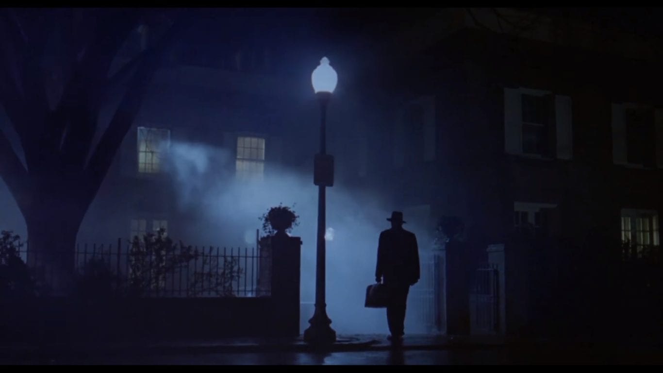 Iconic image of The Exorcist, a silhouette of a man entering a house with a possessed girl inside