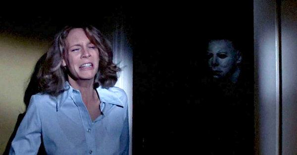Jamie Lee Curtis hiding from Michael Myers in the original Halloween movie
