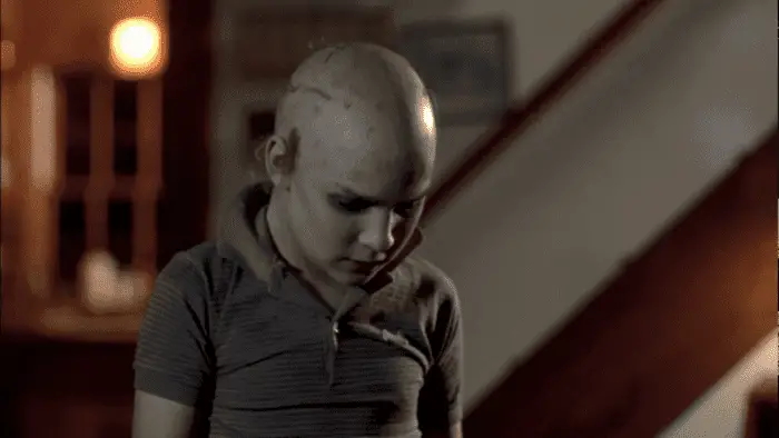 A young Tommy Jarvis tries to trick Jason Voorhees into believing he's just like him in Friday the 13th: The Final Chapter