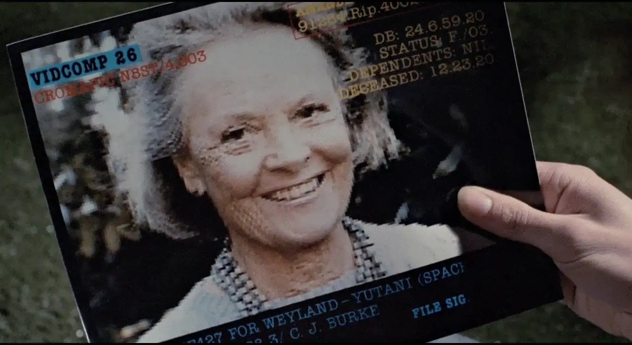 Ripley looks at a photo of her daughter Amanda in Aliens