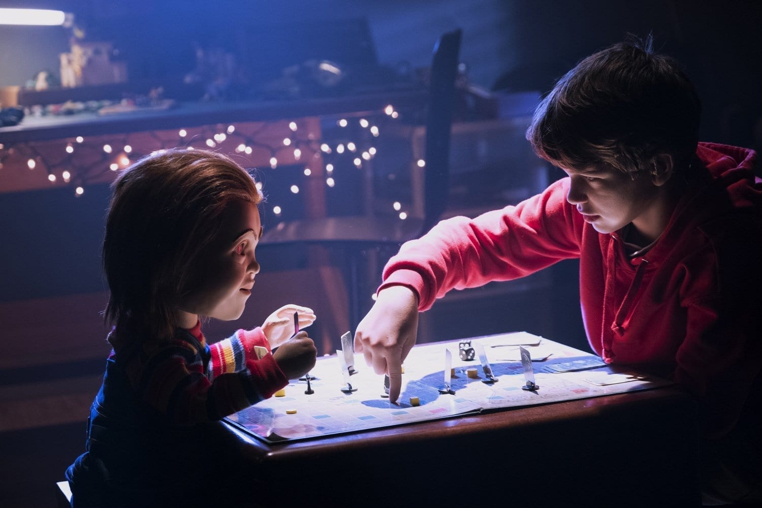 Andy (Garbiel Bateman) and Chucky (Mark Hamill) play a game in Child's Play (2019)