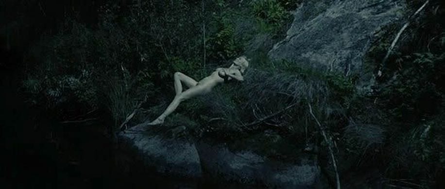 Justine from Lars von Trier's Melancholia moonbathing in light of Melancholia planet