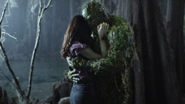 Swamp Thing (Derek Mears) and Dr. Abby Arcane in a tender embracde.