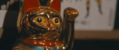 A chinese lucky waving cat made of gold