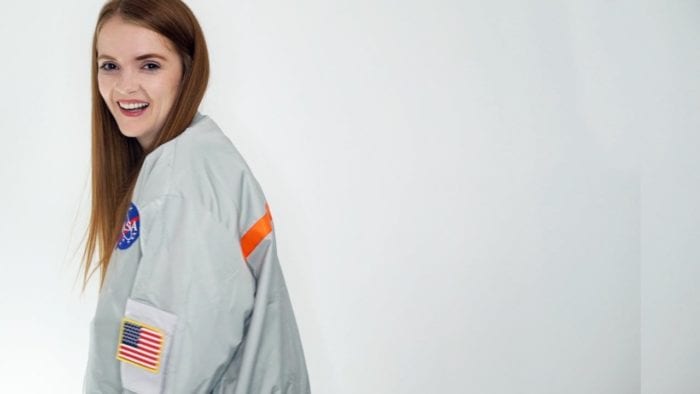 Horror YouTuber Spookyastronauts poses in here NASA jacket