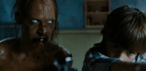 A decaying, yellow-skinned ghosts with blood coming out it's mouth appears next to boy Michael Lutz in the bathroom in The Amityville Horror (2005).
