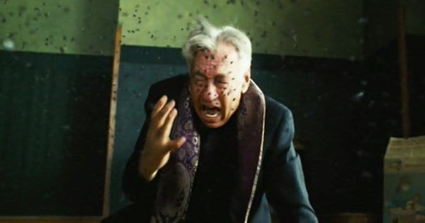 Priest Father Callaway is attacked by bees while attempting to bless a house in The Amityville Horror (2005).
