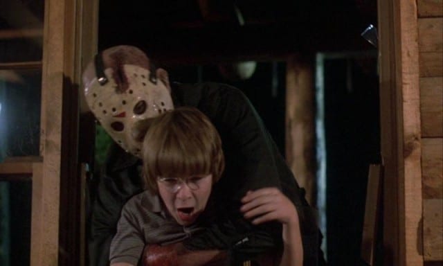 Jason grabs Tommy played by Corey Feldman from behind