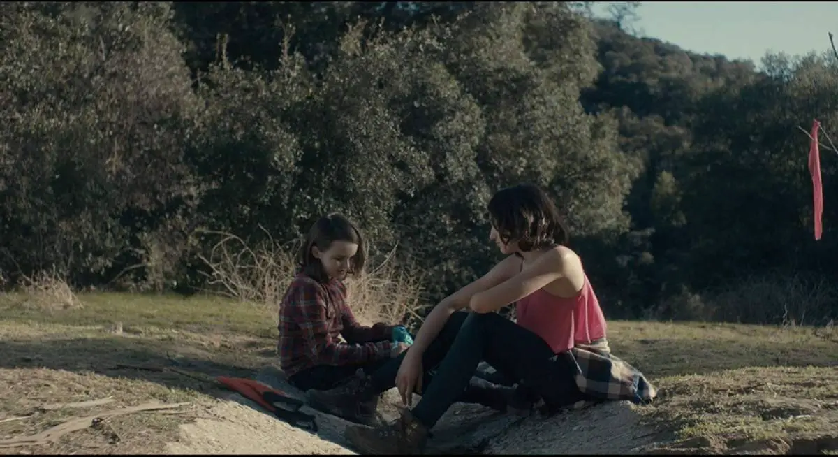 Tate Birchmore, and Nicole Moorea Sherman chat in the woods in Between the Darkness (2019)