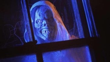 Creep looks in a window in a promo image