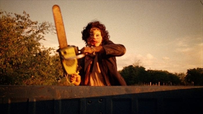 Leatherface chases a truck that's driving away