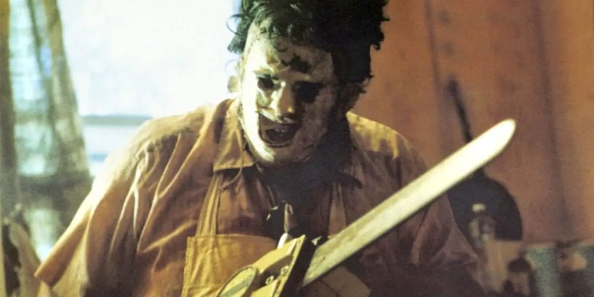Leatherface, chainsaw in hand, getting down to work.