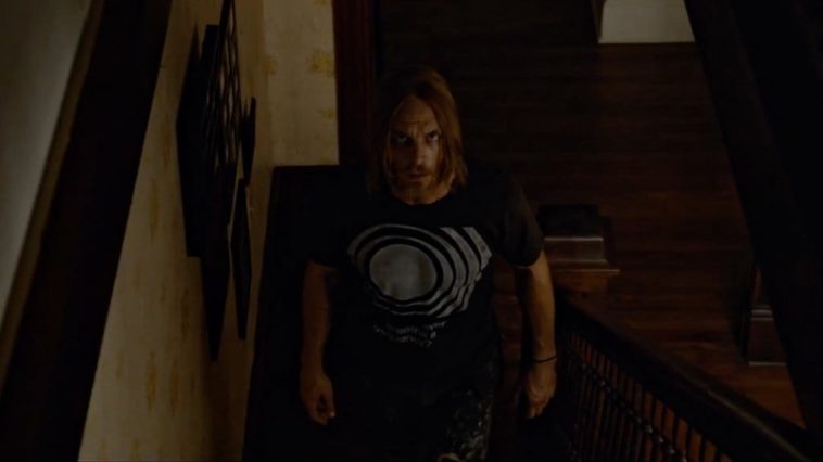 Ethan Embry's character in the Devil's Candy walks slowly up some stairs