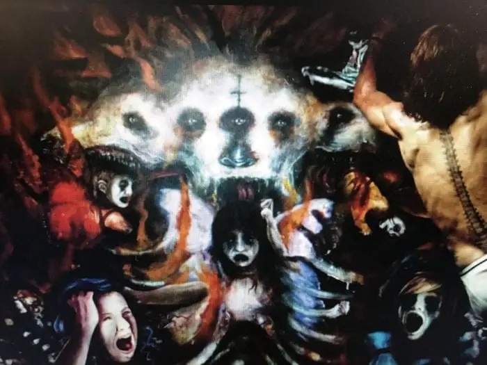 The painting Ethan Embry's character works on in The Devil's Candy, which features a horrific tableau of Cerberus and screaming children