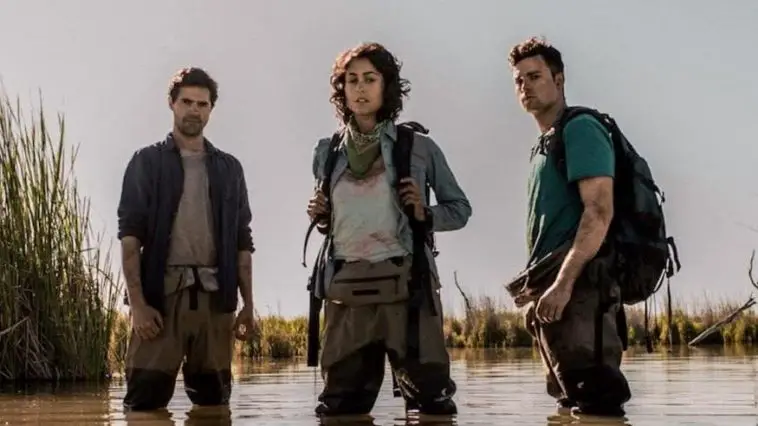 Ben, Pria, and Will stand in the titular Marshes