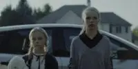 Claire and Olivia stand outside their aunt's house.