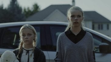 Claire and Olivia stand outside their aunt's house.