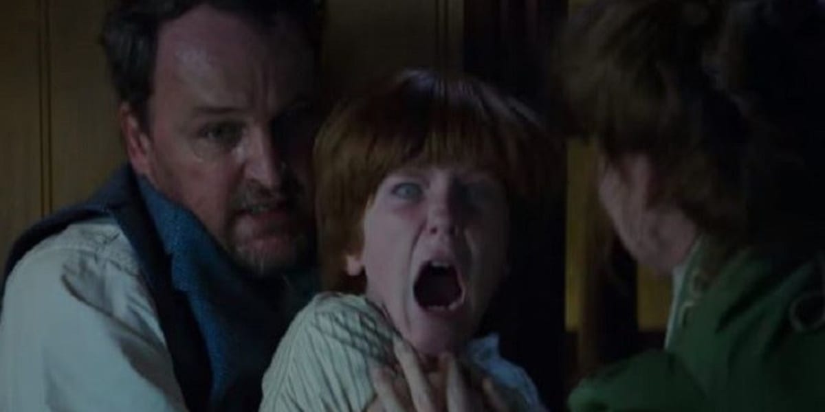 Henry screaming with strange looking eyes while being possessed, held back by Eric with his mother Marion standing before him trying to comfort him in Winchester