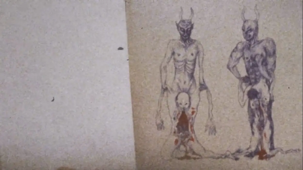 Illustration in a book of two horned devils gripping the bloody, sagging skins of two humans