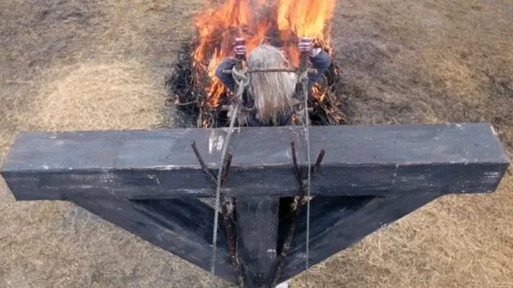 a woman is burnt on a cross in witchfinder general