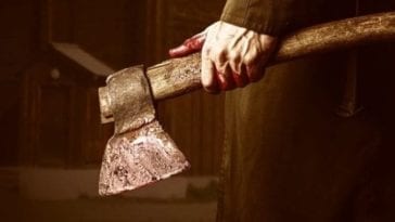 A bloody hand holds a hatchet