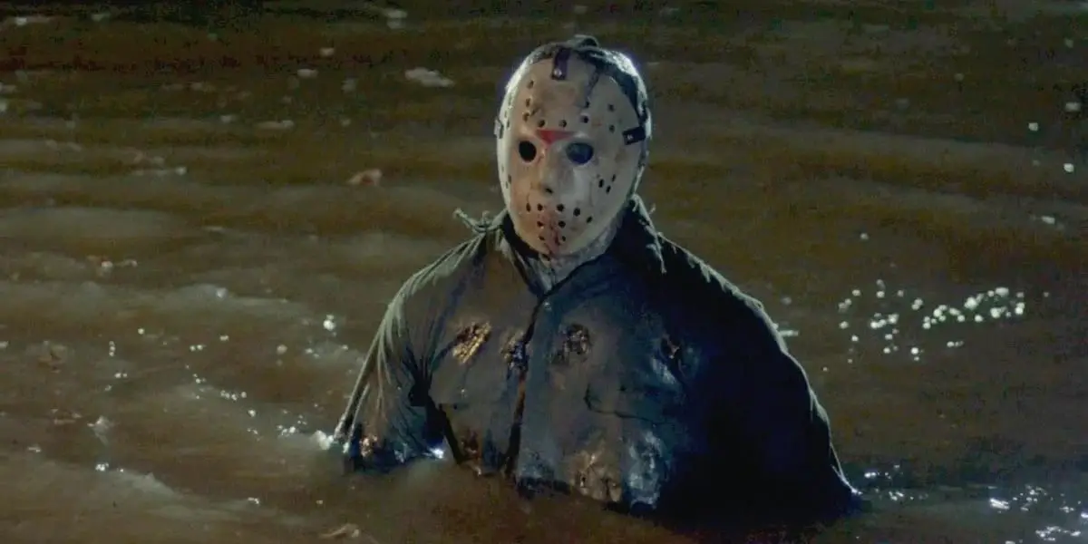Jason stands, deep in water. Stalking his prey.