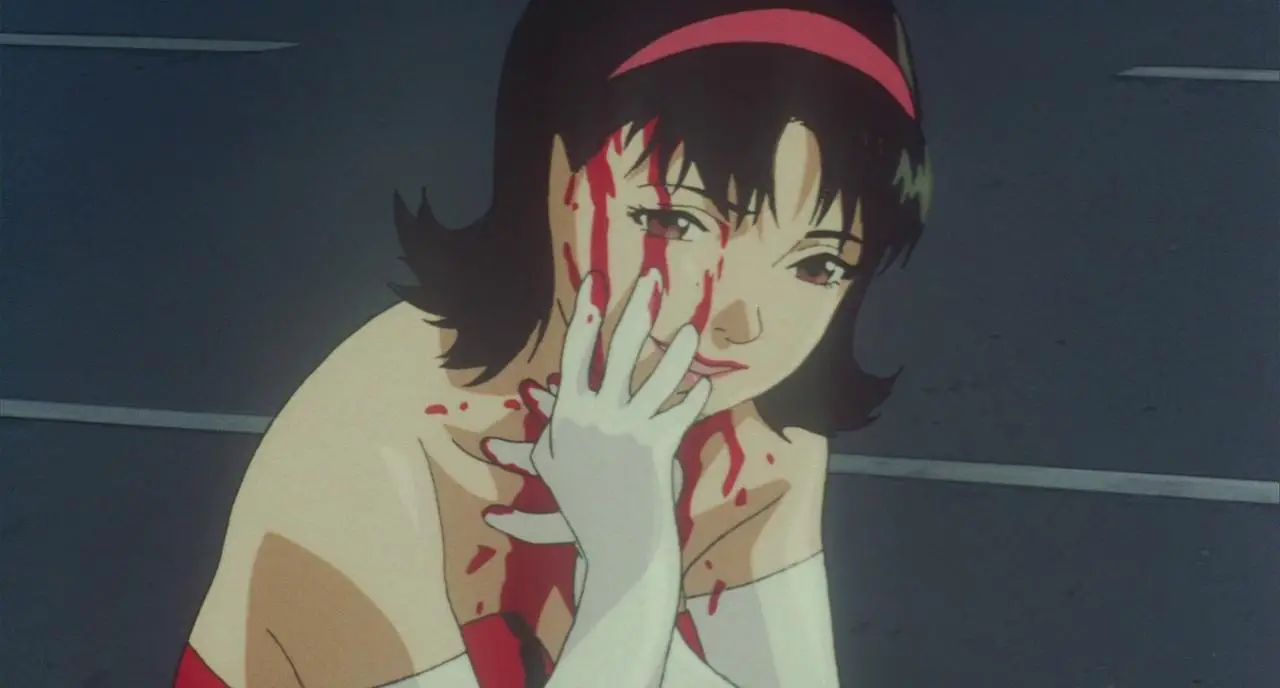Mima smears blood on her face in Perfect Blue