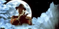 Freddy Krueger blends in with the clouds while the moon is full behind him