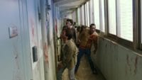 Zombies standing in a hallway