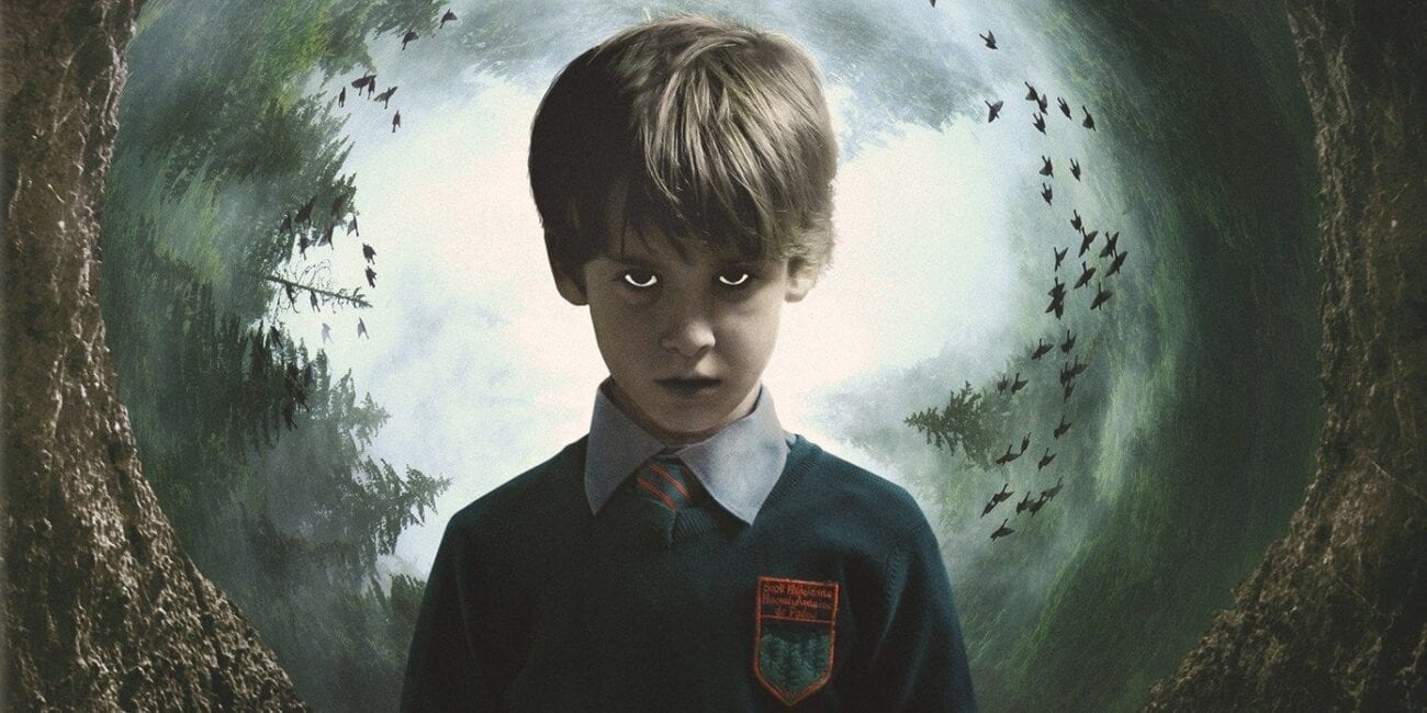 Chris has a vacant and menacing expression on his face, with a large hole in the background