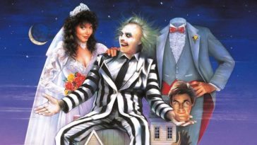 Beetlejuice, played by Michael Keaton, sitting on a house with Barbara Maitland, played by Geena Davis, on the left, and holding the head of Adam Maitland, played by Alec Baldwin, on the right, with the headless Adam standing on the right.