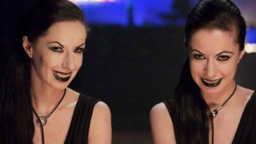 Soska sisters sit in a bar wearing black dresses and black lipstick in American Mary.