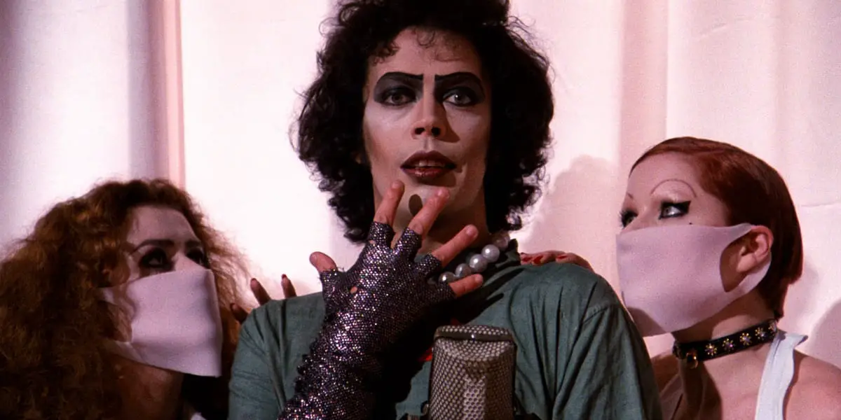 Close-up of Dr Frankenferter and two women wearing masks.