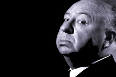 Black and white photograph of Alfred Hitchcock in slight profile.