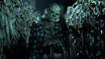 A zombified scarecrow in a corn field.