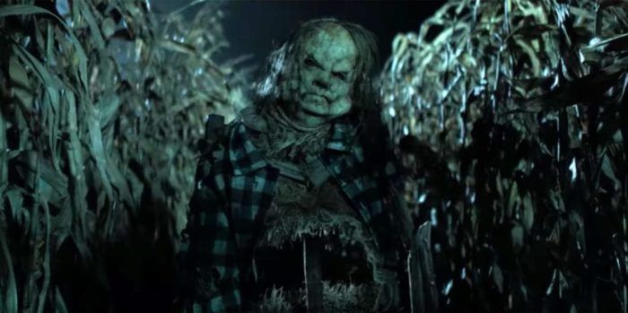 A zombified scarecrow in a corn field.