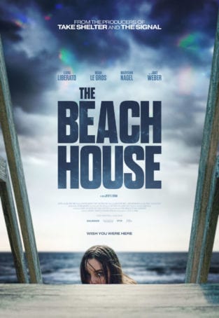 Movie poster for Beach House depicting woman looking over her shoulder onto deck with ocean in background.