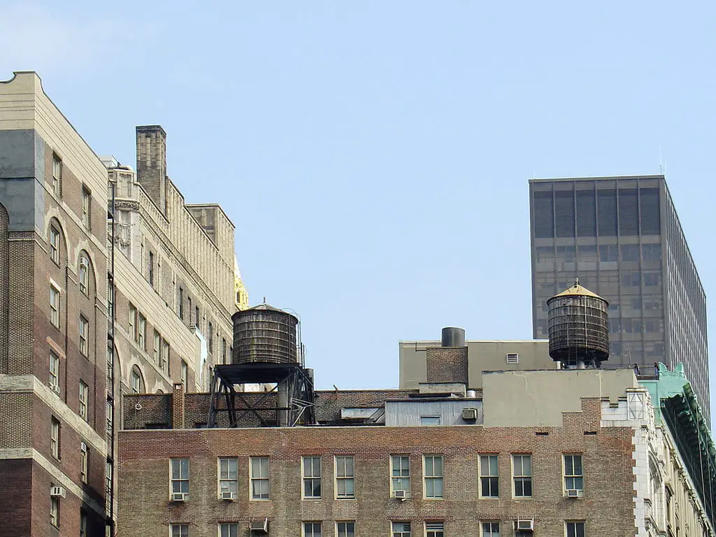Couple of water tanks sit atop a building in New York
