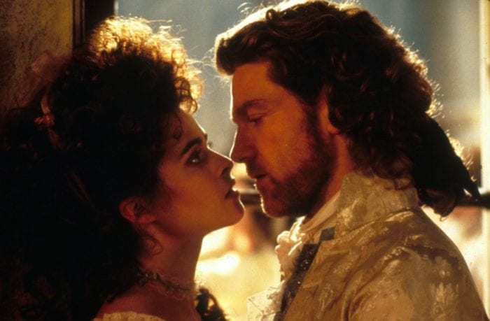 A man and woman look deeply into each other's eyes.