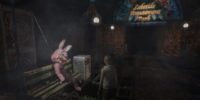 Heather Mason stands in front of a bloody Robbie the Rabbit in Silent Hill 3