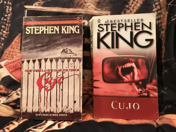 two paperback copies of Cujo sit side by side