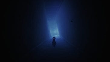 Mono walks towards a mysterious doorway in a dark hallway