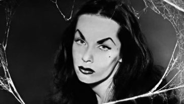 Close-up of Maila Nurmi as Vampira, face framed by cobwebs.