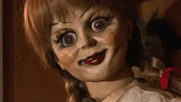 The Annabelle doll staring intently into the camera