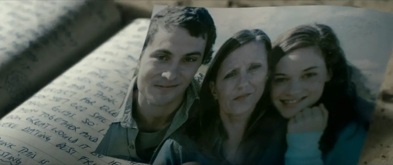 A photo of a happy family: a young man and woman and an older woman.