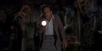 Luther Heggs (Don Knotts) shines a flashlight in an old, cobweb-filled room, in the film, "The Ghost and Mr. Chicken" (1966).