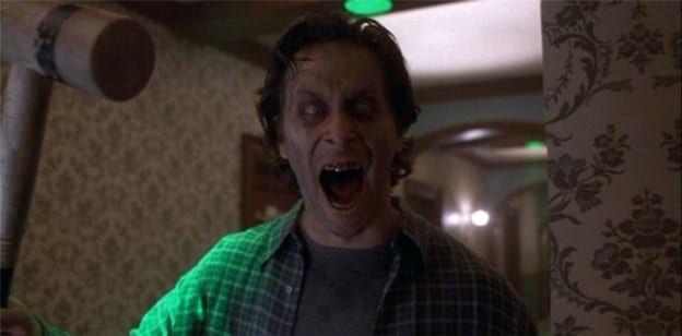 Jack from the miniseries in fully possessed mode, his eyes clouded over, mouth open exposing discolored teeth, wielding a croquet mallet in his right hand.