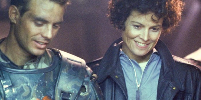 Ripley and Hicks are standing and smiling in Aliens.