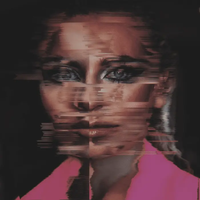 A distorted image of a woman's face. She is wearing a pink shirt