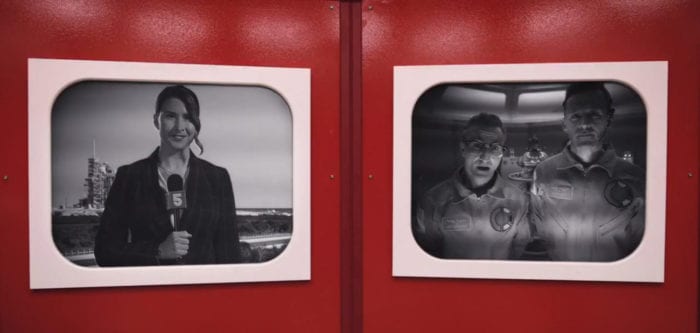 Reporter Ann Poole (Kara Kimmer) conducts a remote interview with astronauts Major Ted Lockwood (Breckin Meyer) and Captain Alex Toomey (Ryan Kwanten), from the TV show, "Creepshow."